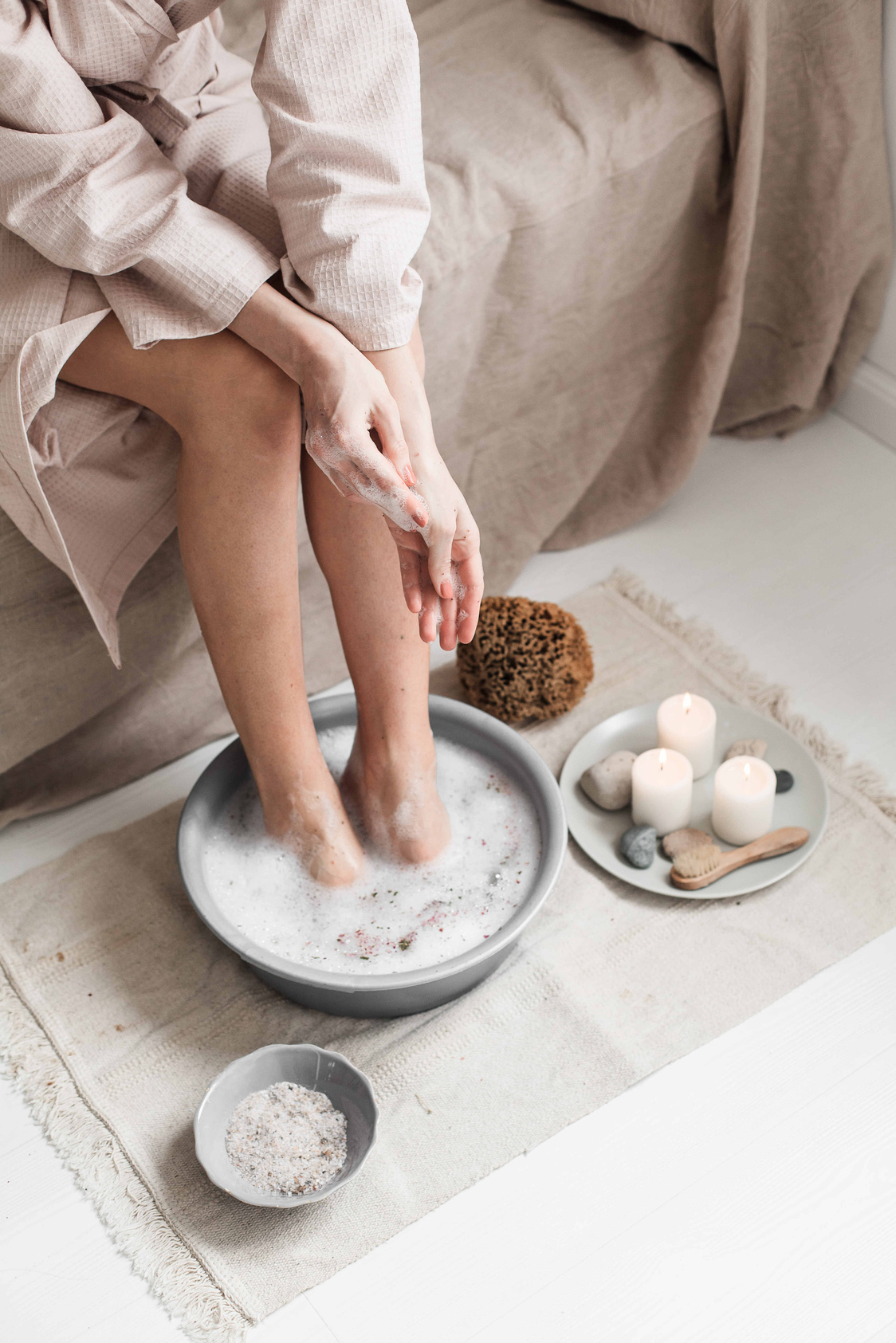 Woman Soaking Her Feet in a Basin